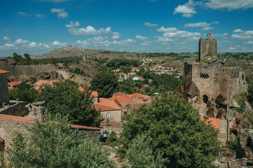 Obraz premium Stone castle and tower over rocky cliff