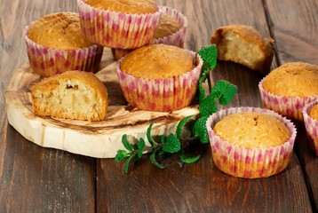 Vanilla cupcake, homemade pastry on wooden background