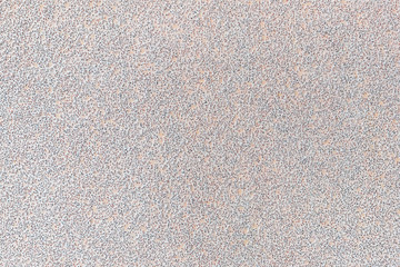 Texture of white extra coarse aluminum oxide sandpaper. Abrasive paper for dry sanding. Processing wood, metals and furniture. Background.