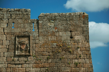 Family coat of arms carved on a wall made of stone