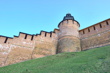 Scenic view of old wall of kremlin in historic center of Nizhniy Novgorod. Beautiful sunny summer look of wall with towers of red bricks in ancient touristic city in Russian Federation