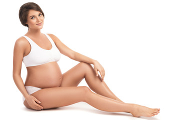 Fototapeta premium Pregnant woman on white background