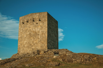 Naklejka premium Stone squared tower over rocky hill