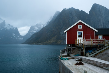 Typical red rorbu fishing huts with sod roof on Lofoten islands in Norway