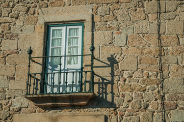 Fototapeta na wymiar Balcony on a stone wall from old building at Guarda