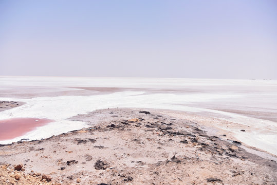DEGUECHE, TN - JULY, 2019: Chott el Djerid, also spelled Sciott Gerid and Shott el Jerid, is a large endorheic salt lake in southern Tunisia. 