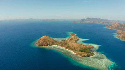 Fototapeta na wymiar aerial tropical landscape islands with blue lagoons, coral reef and sandy beach. Palawan, Philippines. Island Busuanga of the Malayan archipelago with turquoise lagoons.