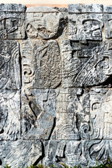 Obraz premium Mayan glyphs also known as Mayan script the writing system of the Maya civilisation. This is from a standing wall in the ball court at Chichen Itza. 