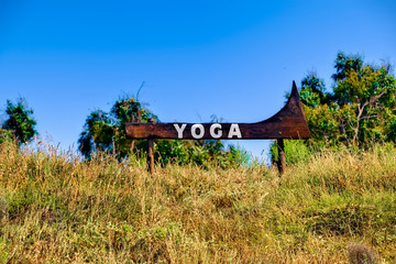Shield yoga stands in the countryside
