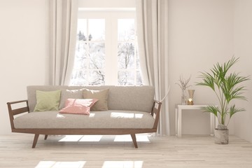 Stylish room in white color with sofa and winter landscape in window. Scandinavian interior design. 3D illustration