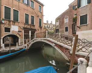 Fototapeta na wymiar Canal with bridge in Venice
