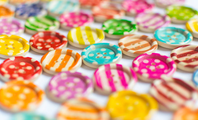 Fototapeta na wymiar Full frame and selective focus photo of various and colorful sewing buttons