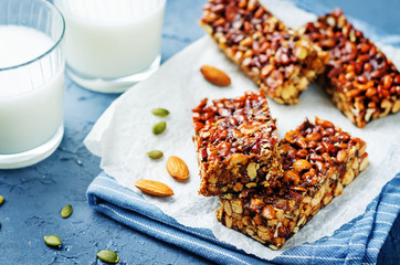 Honey nuts bars with glasses of milk