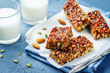 Honey nuts bars with glasses of milk