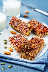 Honey nuts bars with glasses of milk