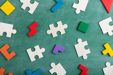 Creative solution for idea - business concept, jigsaw puzzle on the blackboard