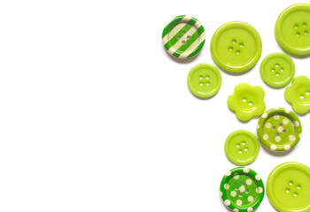 Various green sewing buttons isolated on white background