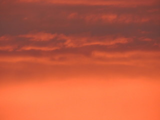 red sky with clouds