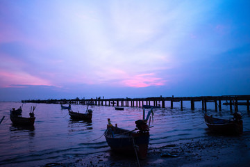 Fototapeta premium local fishing boat in the sea at sunset