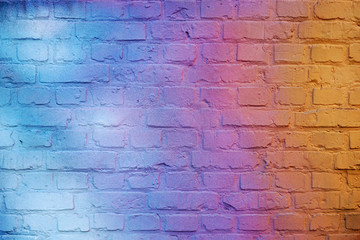Retro background. Brick wall painted in bright gradient colors