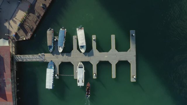 Footage from top view of speed boat stop at harbor deck at Jesselton Point, Kota Kinabalu, Sabah.