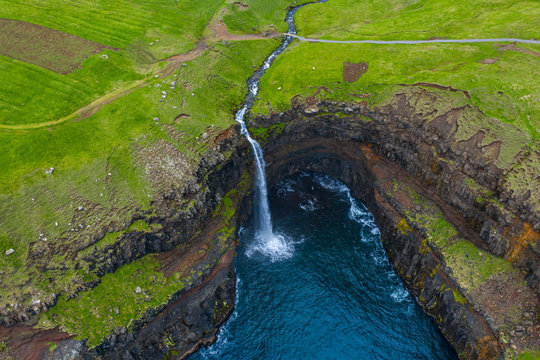 Mulafossur waterfall aerial drone view in Gasadalur, Vagar, Faroe Islands