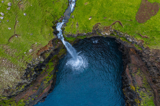 Mulafossur waterfall aerial drone view in Gasadalur, Vagar, Faroe Islands