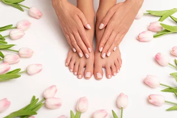 Wall murals Pedicure Female hands and feet with perfect done pedicure.