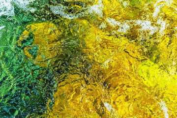 Clear water in colorful colors in abstract patterns