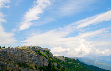 Naklejka premium View to the mountains and blue sky with white clouds