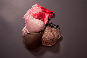 four different colored bras