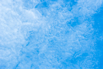 Fototapeta na wymiar white cirrocumulus clouds on blue sky