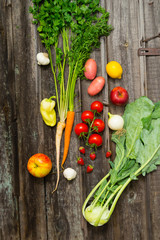 fresh fruits and vegetables on weathered wooden