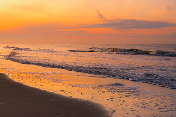 Dramatic sunset over the oncoming sea