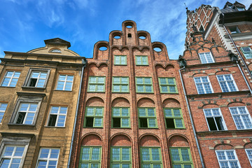 Fototapeta na wymiar Facade historic brick tenement houses building in Gdansk.