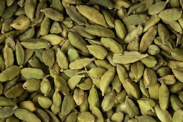 heap of fresh green cardamom background. top view