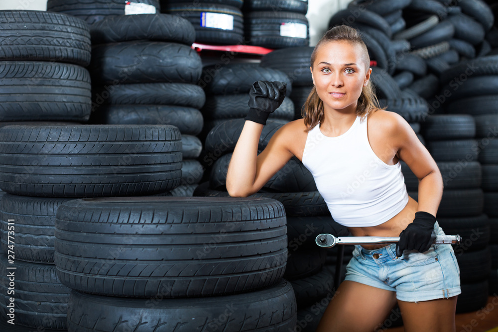 Poster girl working as auto mechanic