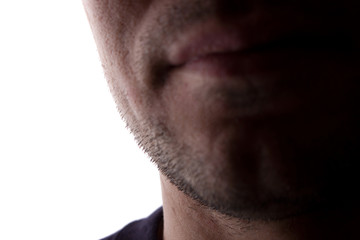 Chin of an unshaven young man close up - silhouette, isolate