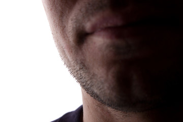 Naklejka premium Chin of an unshaven young man close up - silhouette, isolate