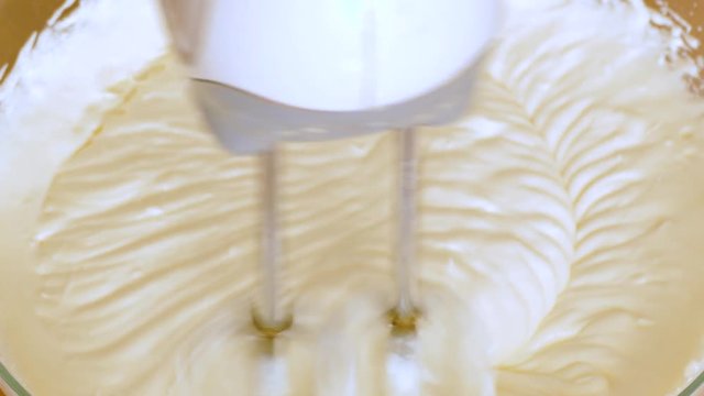 beat cream cheese. close up.