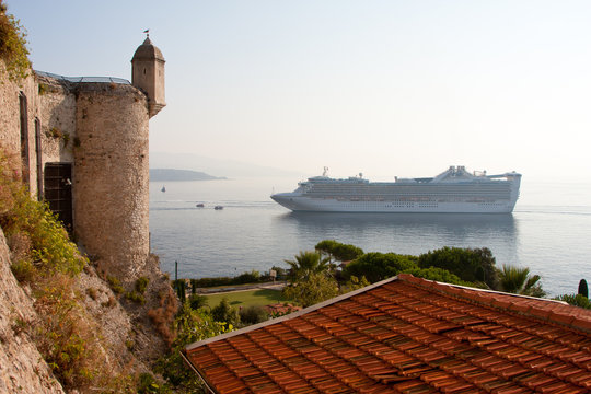 cruise liner on the background of an ancient castle