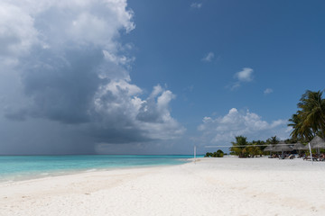 Fototapeta na wymiar Wide sandy beach on a tropical island in Maldives
