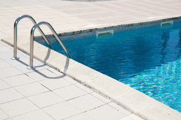 Metal staircase for entrance in swimming pool