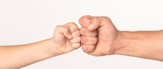 Little and big fists of father and son, panorama