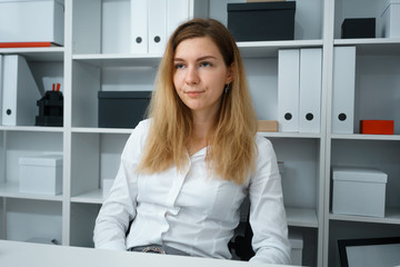 portrait of young beautiful brunette businesswoman work in office like her job