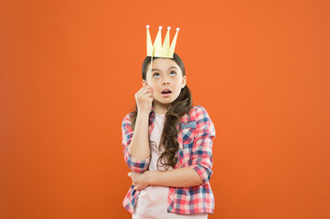 Im a big boss here. Little big boss on orange background. Cute girl boss wearing prop crown. Small happy child with big surprise on her face. Adorable boss lady dreaming big ambitious dreams