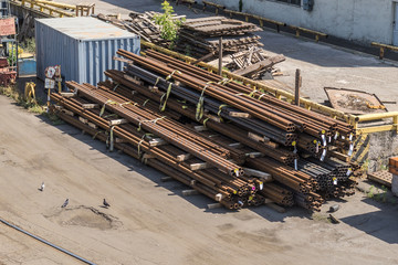 Stacks of steel pipes unloaded on the ground.