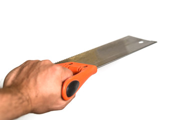 Male hand holding a saw for wood. Isolated on white background.