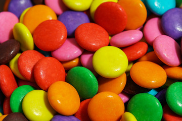 Fototapeta na wymiar detail of colorful sweet chocolate pellets