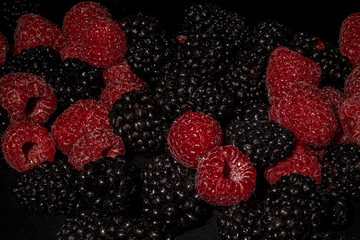 resh berries on a black background